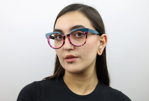 Woman wearing these luxury designer SEE Eyeglasses