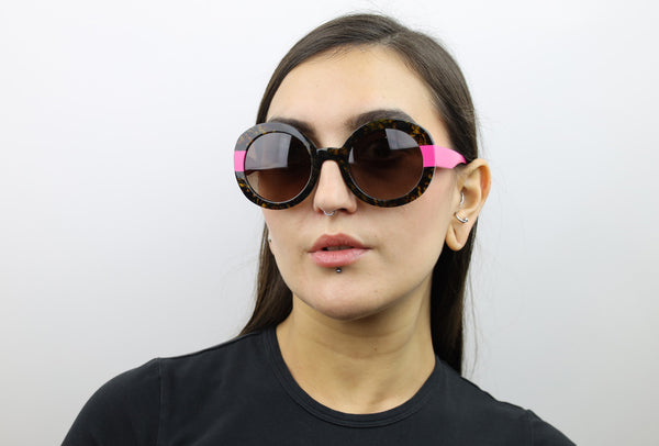 Woman wearing these luxury designer SEE Sunglasses