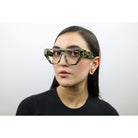 Woman wearing these luxury designer SEE Eyeglasses