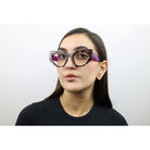 Woman wearing these luxury designer SEE Eyeglasses