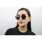 Woman wearing these luxury designer SEE Sunglasses