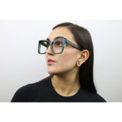 Woman wearing these luxury designer SEE Eyeglasses