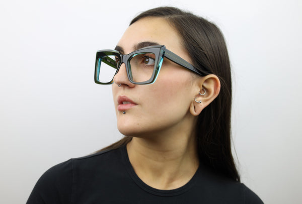 Woman wearing these luxury designer SEE Eyeglasses