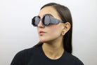 Woman wearing these luxury designer SEE sunglasses