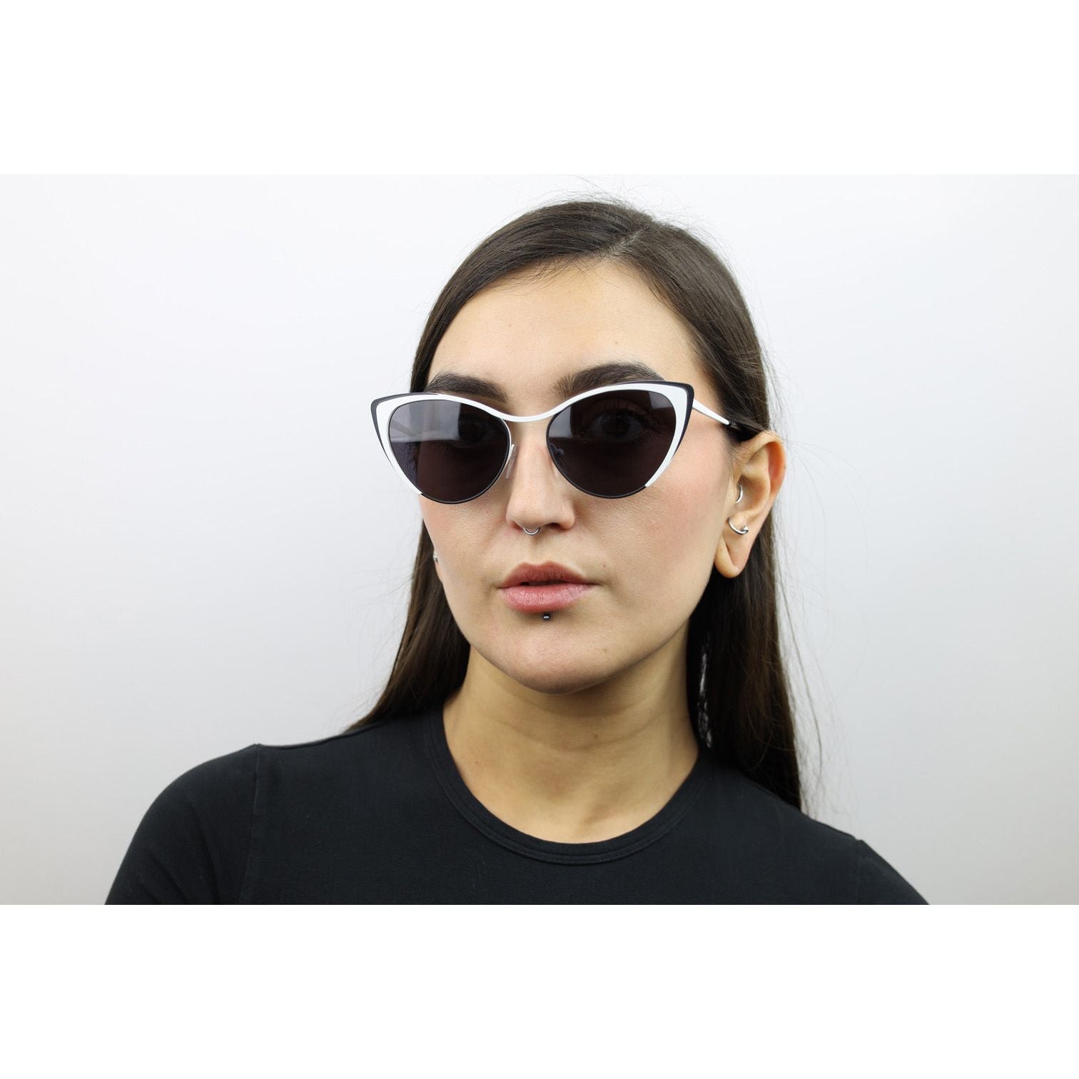 Woman wearing these luxury designer SEE cat eye sunglasses. Black glasses.