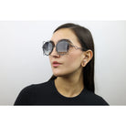 Woman wearing these luxury designer SEE sunglasses